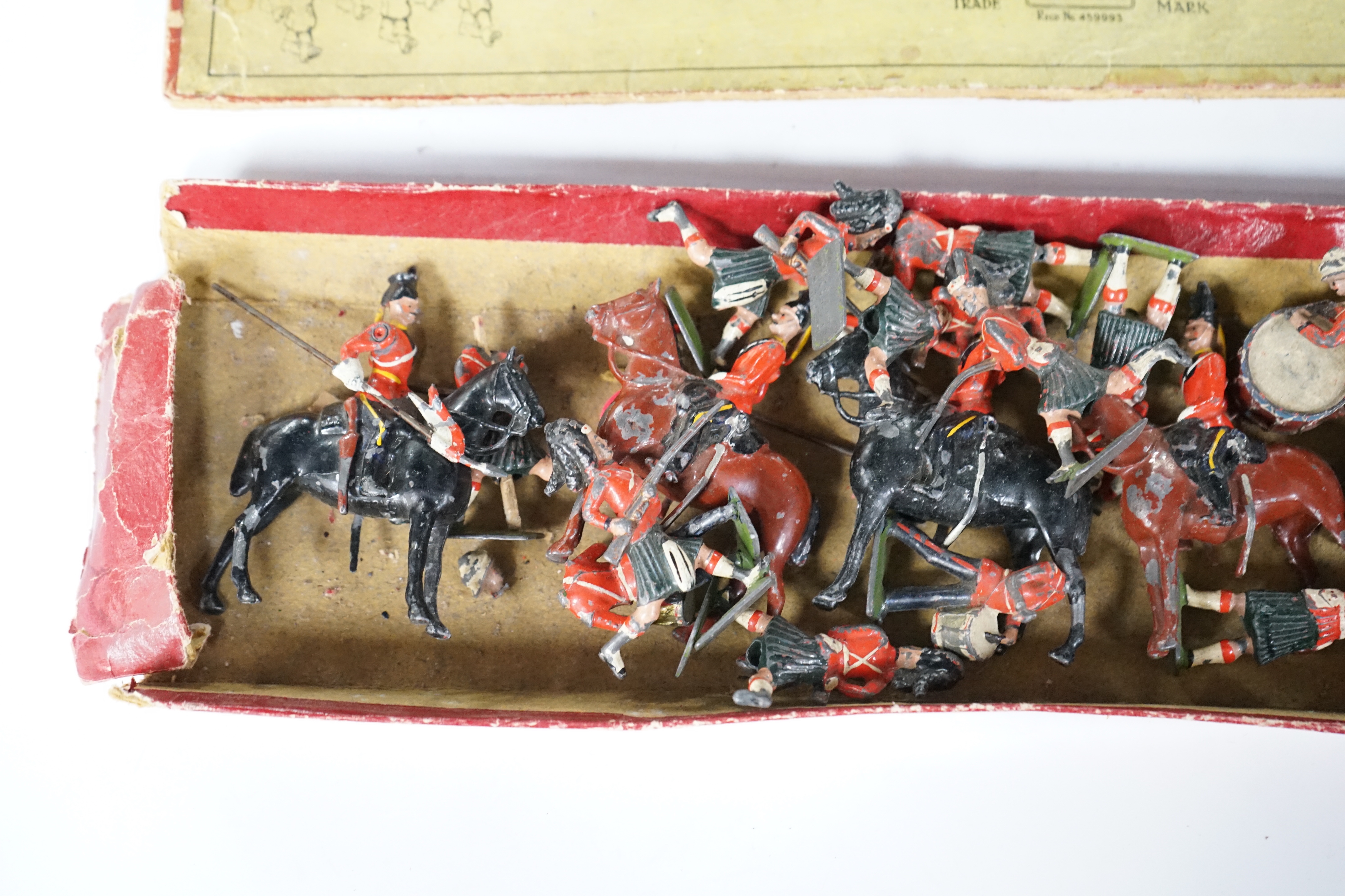 Britain's soldiers from set 1858, British Infantry in Battle Dress with original box, and Scottish Highlanders and mounted Lancers